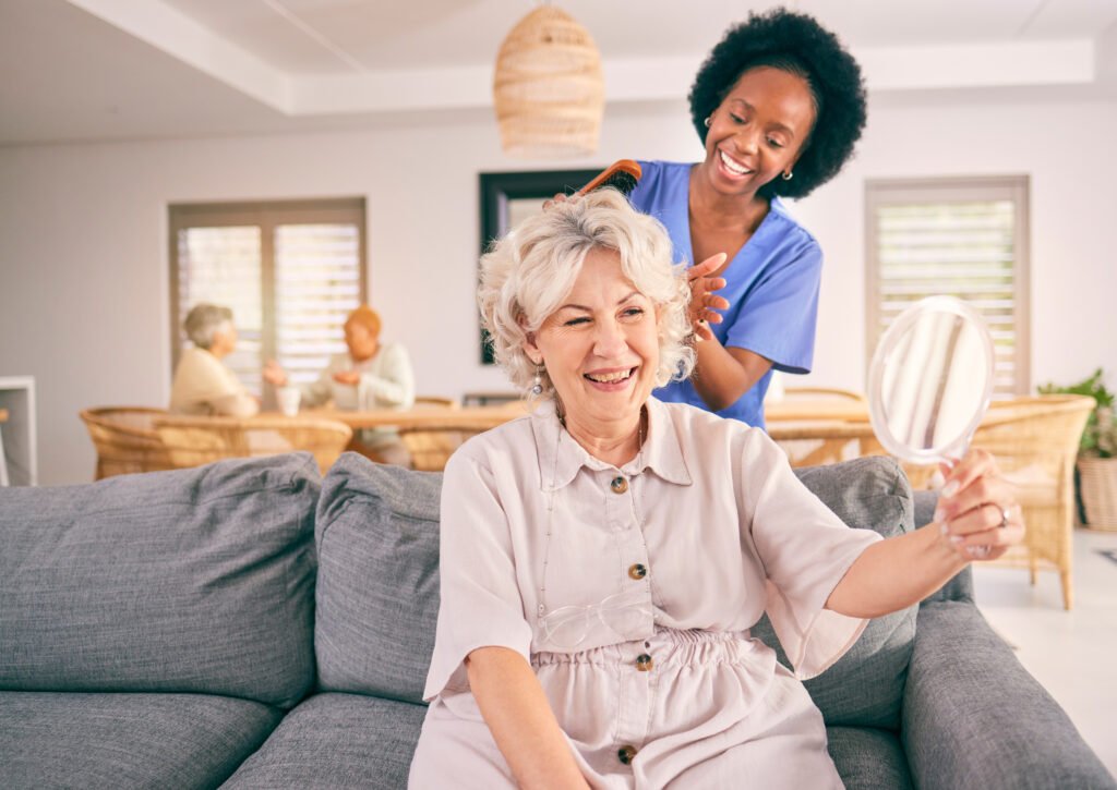 Caregiver providing personal care assistance to a senior woman in a residential care home for seniors