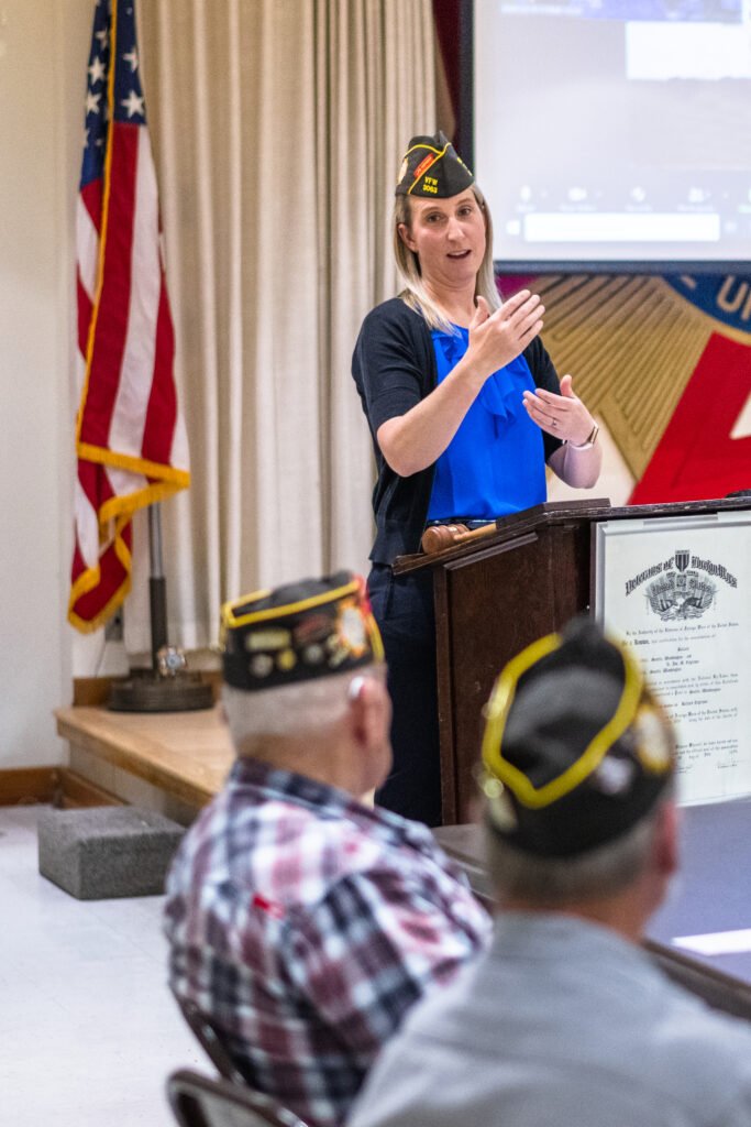 Michigan veterans service officer explaining VA Aid and Attendance application process to local veterans