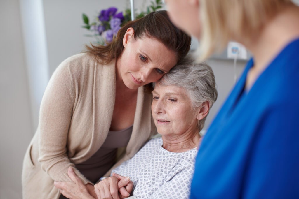 family supporting senior during hospital discharge showing transition to senior care planning