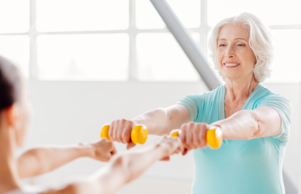 Short-term nursing home rehabilitation with elderly woman doing physical therapy exercises