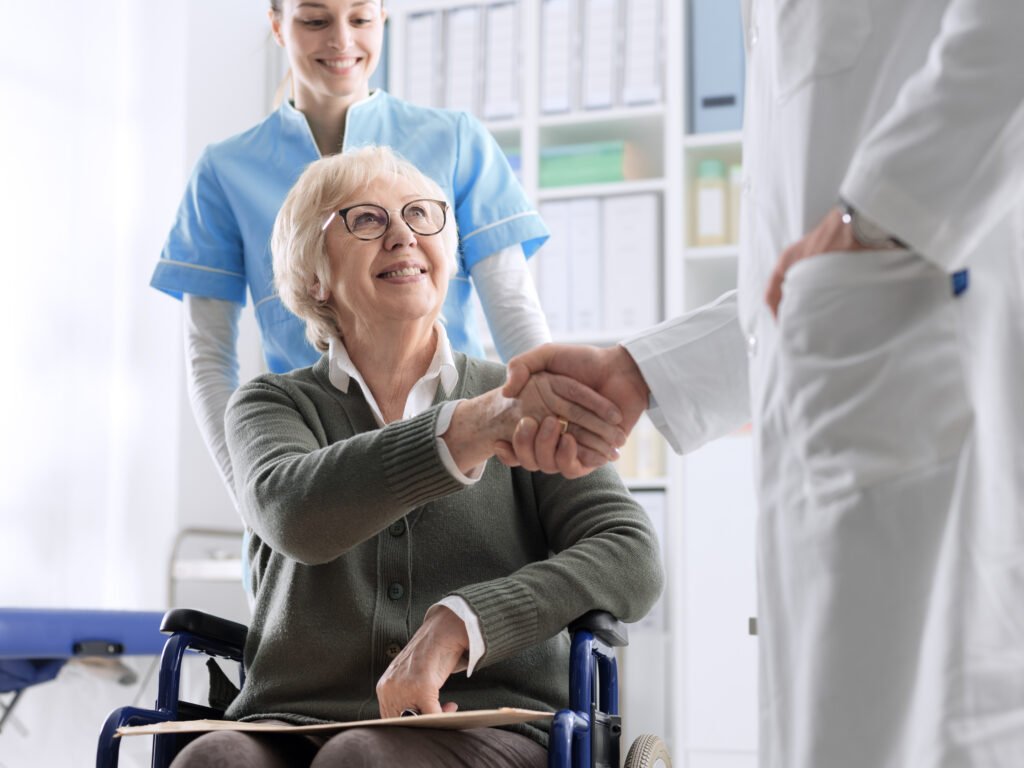 Elderly patient meeting healthcare provider while choosing care after hospital discharge