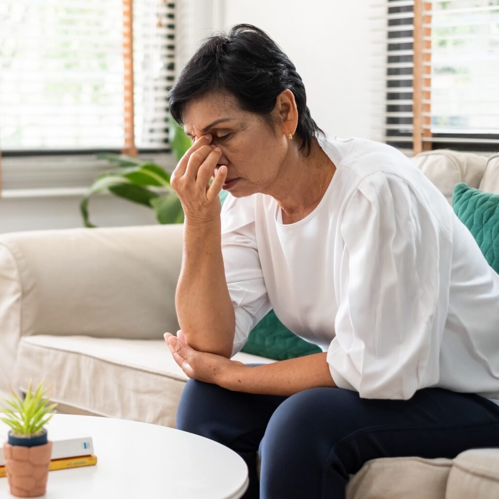 Family caregiver experiencing emotional overwhelm while caring for a loved one during hospice care planning