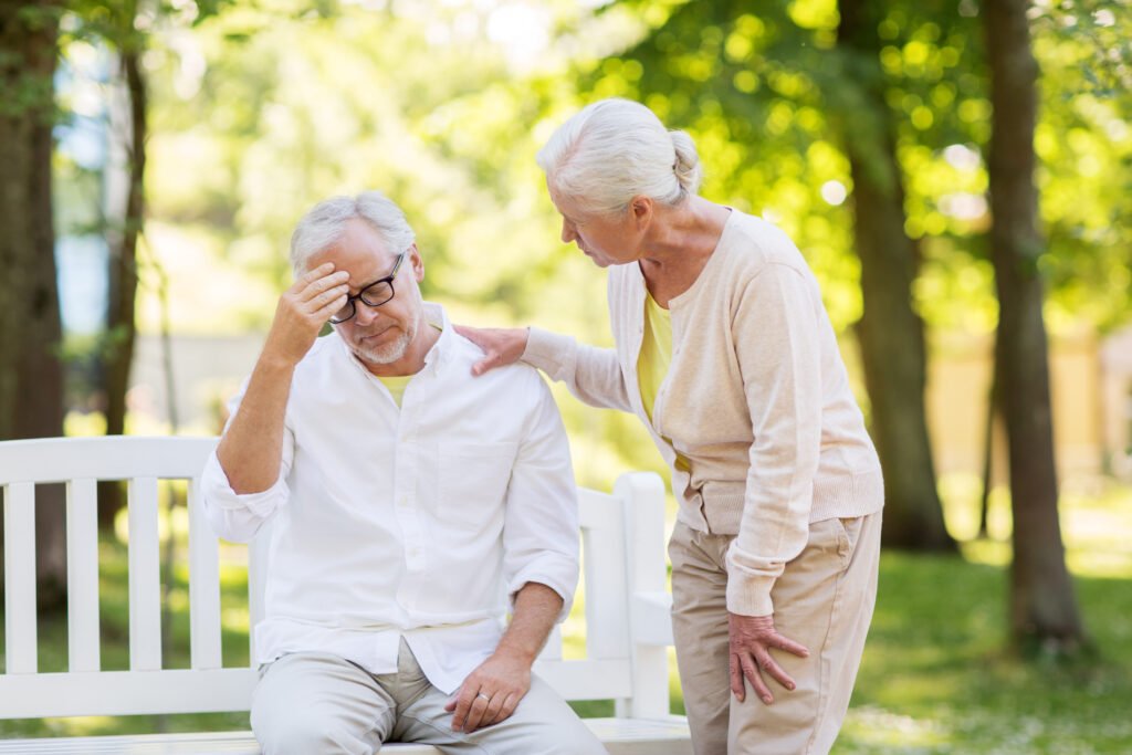 Senior woman comforting overwhelmed husband while discussing where to start with senior care