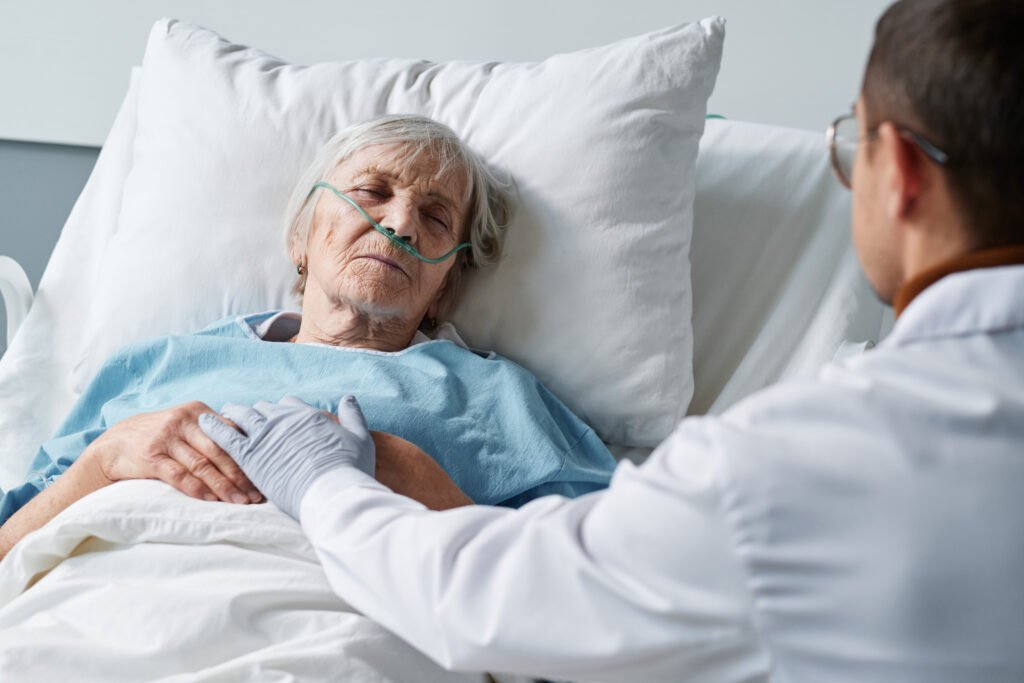 Hospice care physician helping manage pain and difficult symptoms that may indicate it is time for hospice care