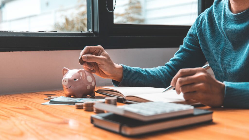 Person saving money while researching "What does Medicare cover for long-term care?" and planning for future senior care expenses.