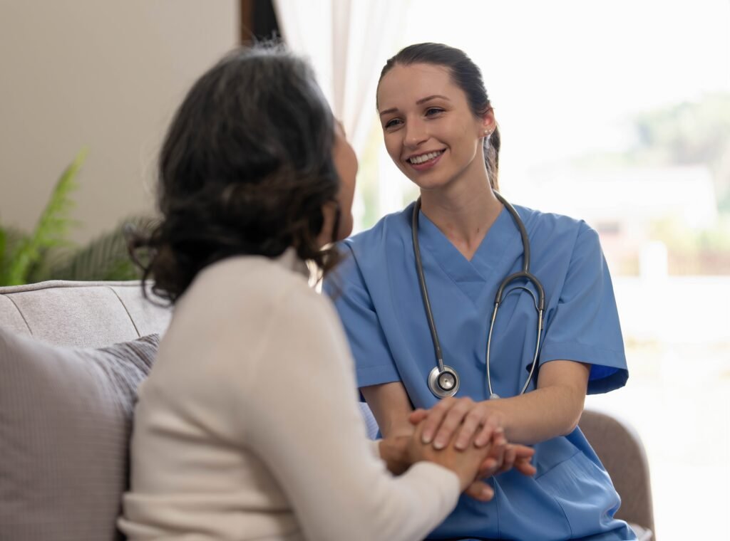 Healthcare professional offering reassurance and compassionate support to a person living with dementia.