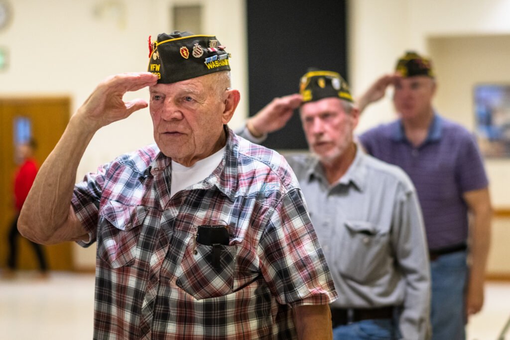 Older Veterans learning about getting paid to care for a family member in Michigan through Veterans benefits and other caregiver assistance programs.