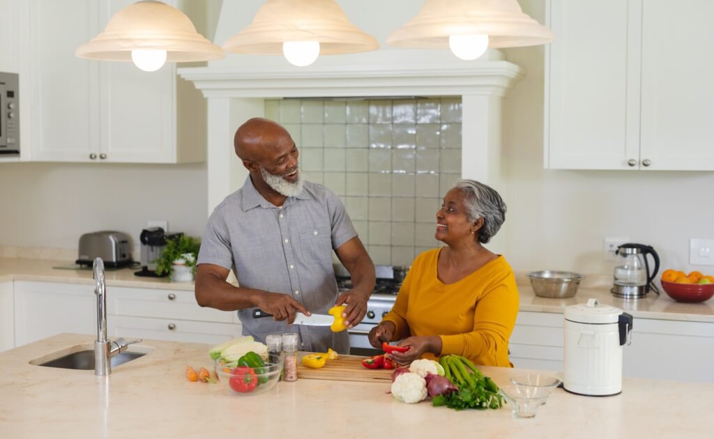 Older adults preparing a healthy meal together at home