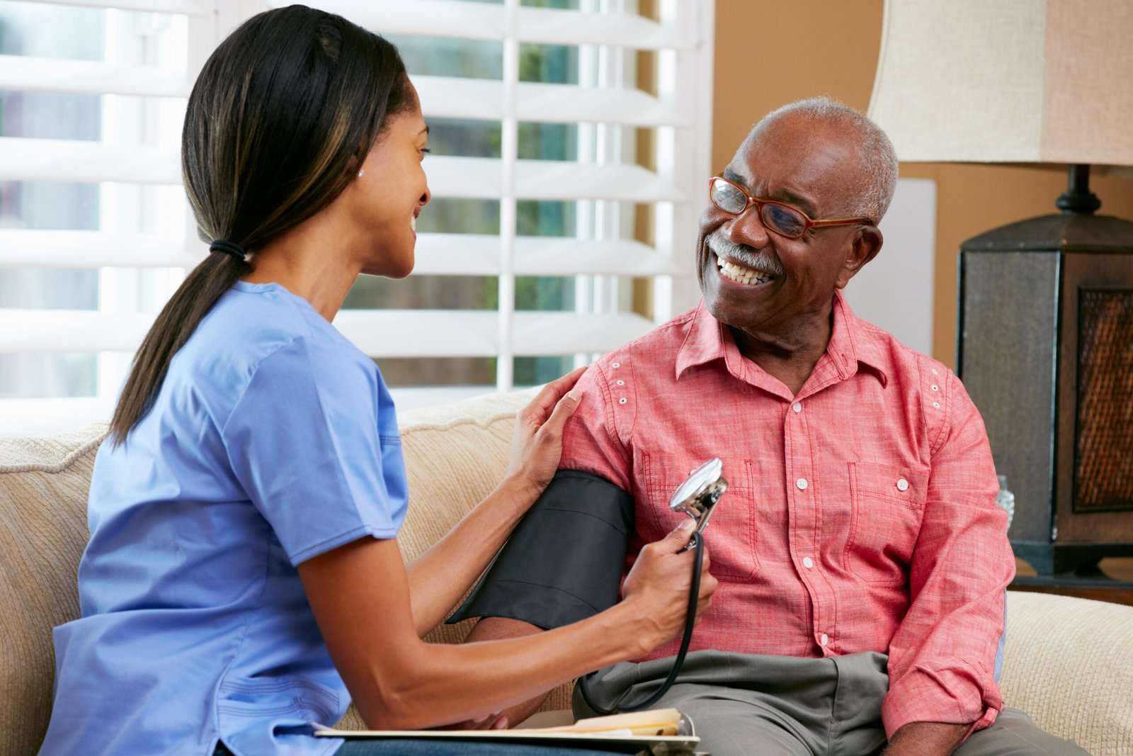 Caregiver assisting an older adult at home