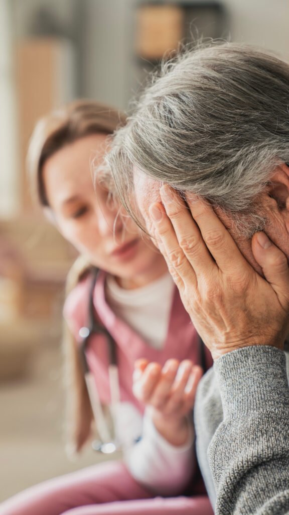 Healthcare professional talking with an older adult about signs it may be time for hospice in memory care