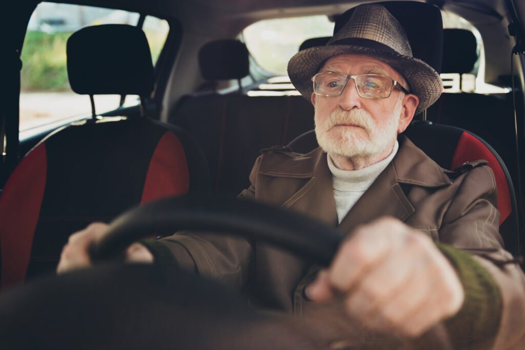 Older man driving, illustrating why people with dementia get lost on familiar routes